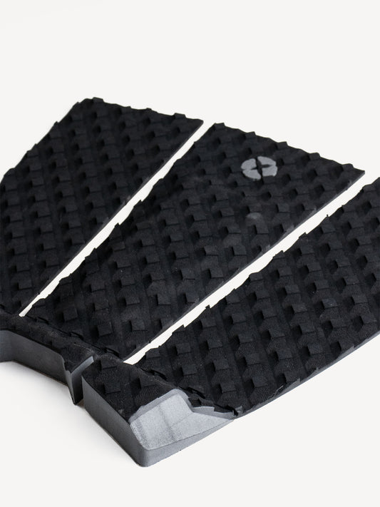 “Side view of black traction pad showing grip and kick tail”