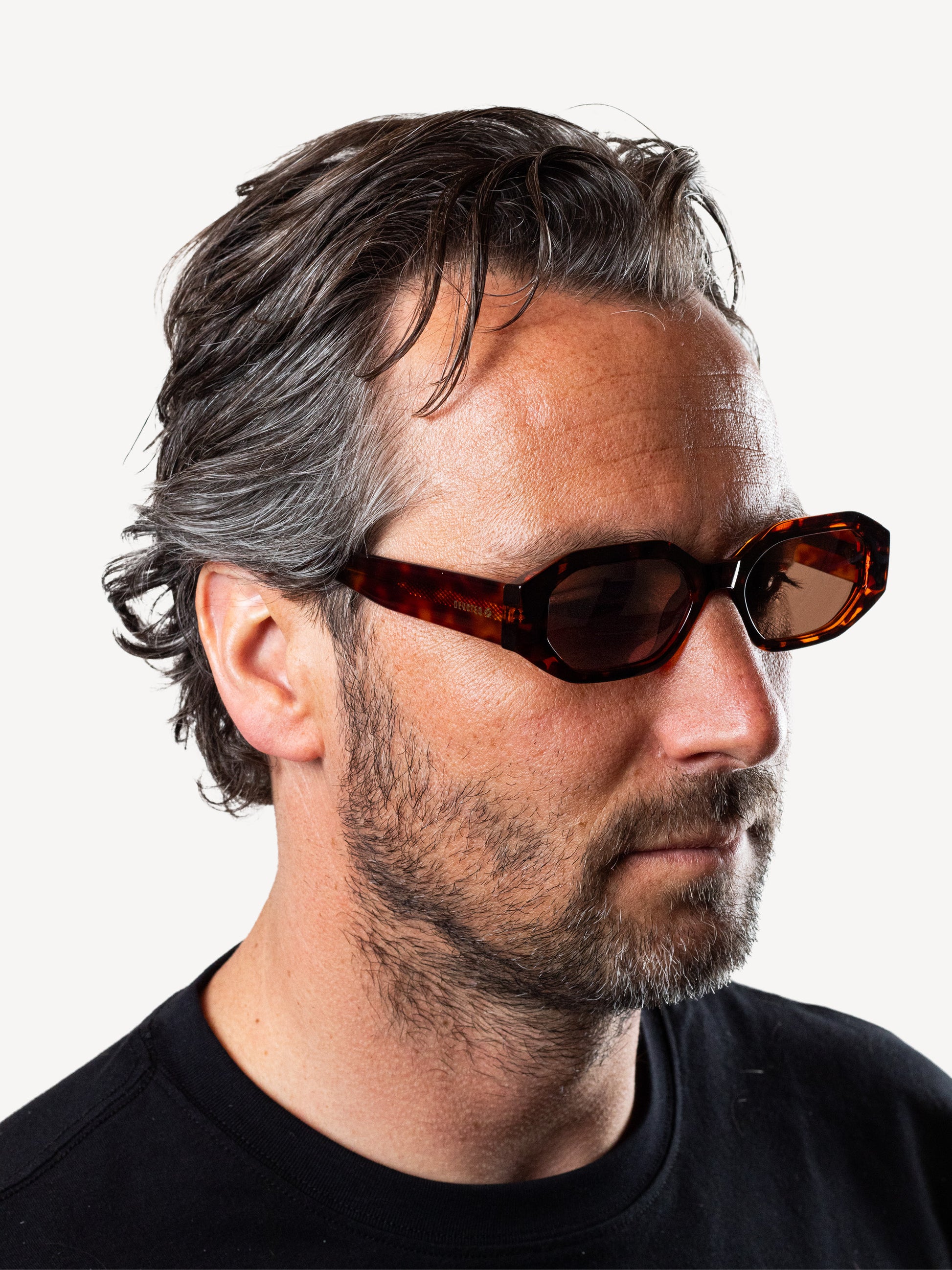 Angel polarized sunglasses in brown leopard worn by model, showing cat-eye shape and light fit”