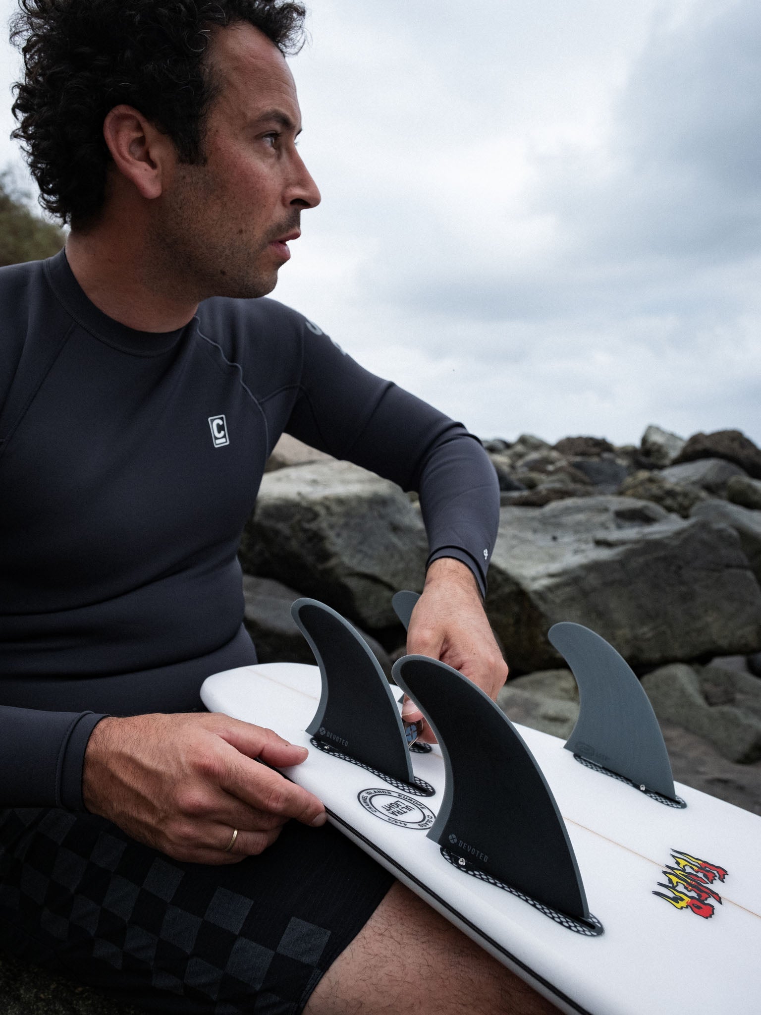 “Side view of CSF Quad dual-tab fins mounted on board, showing balance and fibreglass construction”
