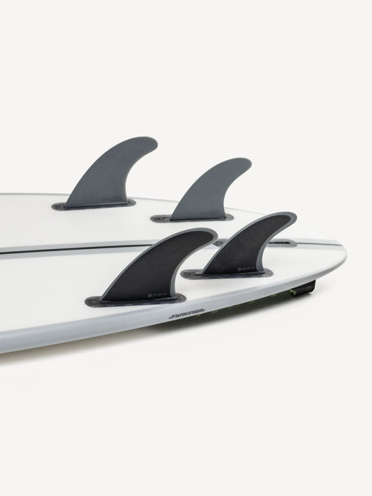“CSF Quad single-tab fibreglass fins mounted on surfboard outdoors, highlighting full quad setup and fit”