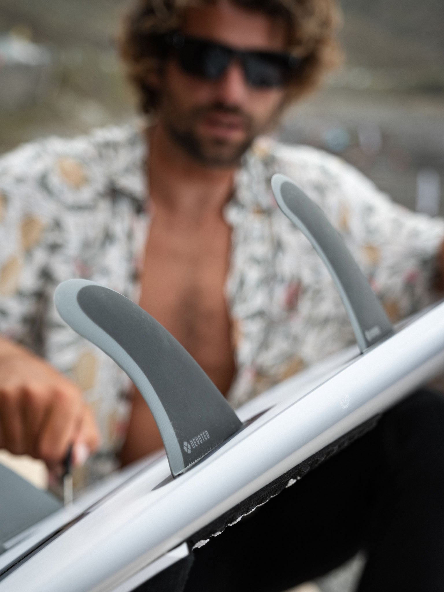 “Devoted CSF Quad fin set single-tab configuration in use on surfboard outdoors, emphasizing performance design”