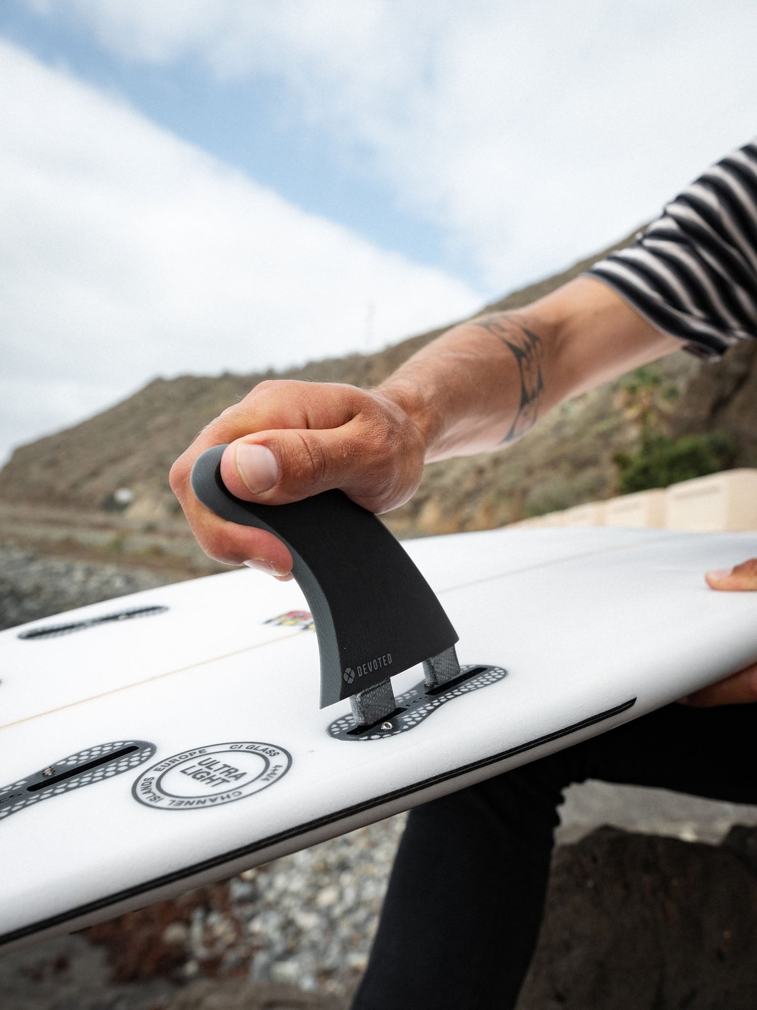 “Side angle of CSF Thruster fin set dual-tab on board, highlighting center and side fin placement”
