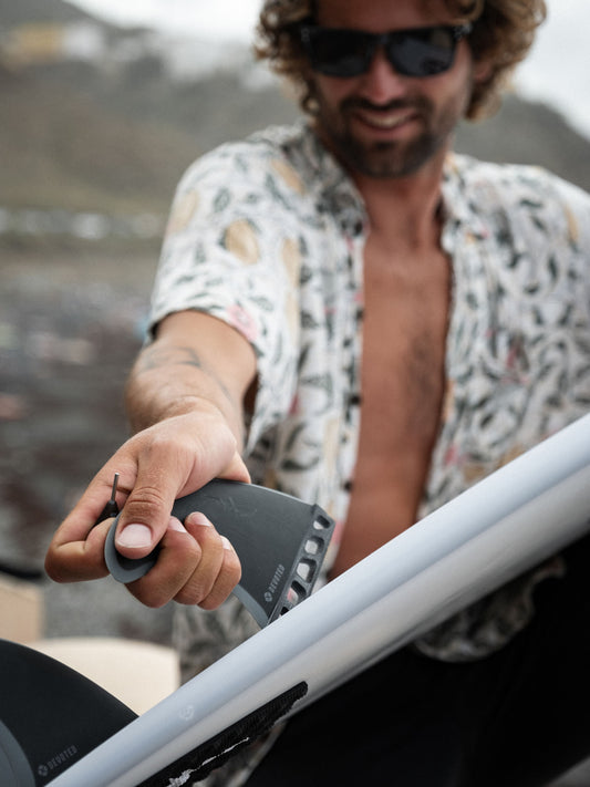 “CSF Thruster single-tab fibreglass fins mounted on surfboard, showcasing classic thruster setup outdoors”
