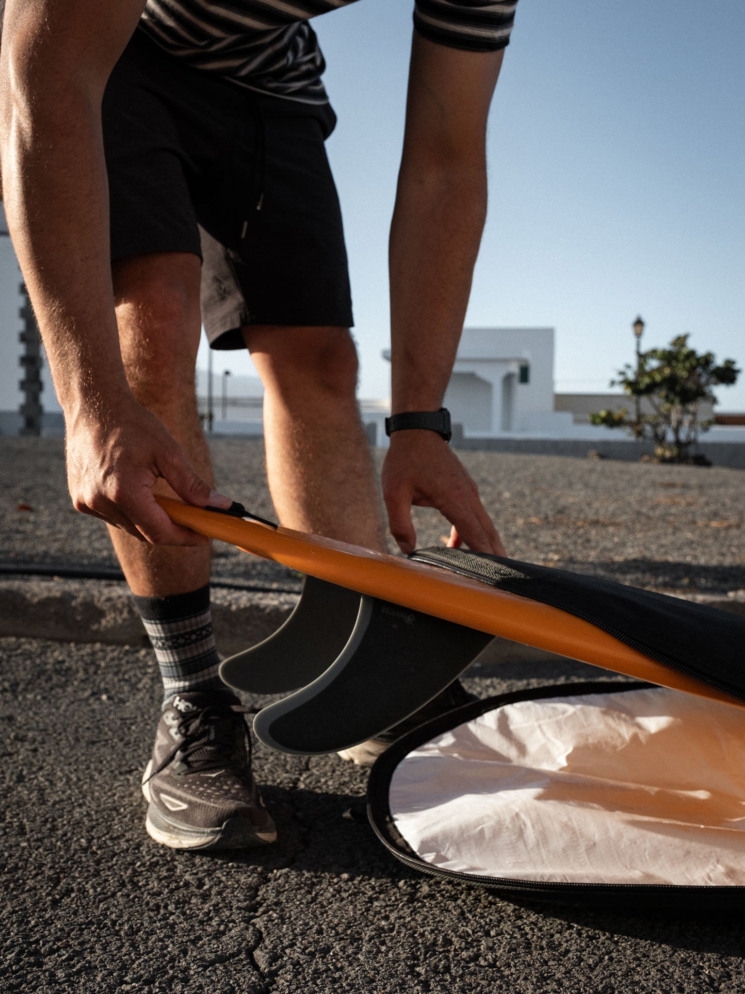 “Side angle of CSF Twin+1 dual-tab fin set on surfboard, highlighting performance shape and fibreglass finish”
