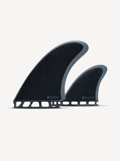“Devoted CSF Twin+1 fibreglass fin set single-tab shown in product layout with two side fins and center trailer fin”