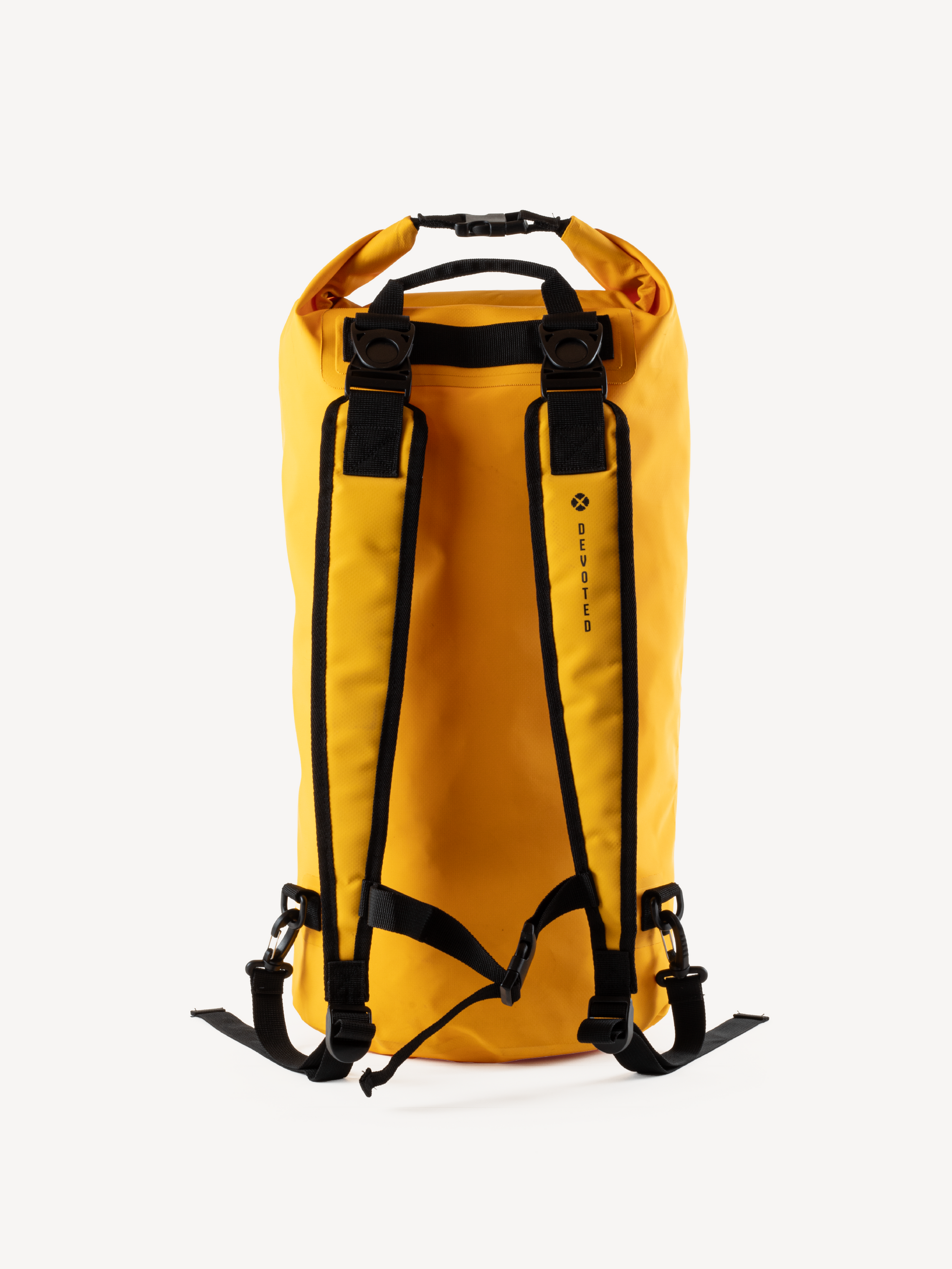 “Side view of yellow waterproof dry bag with shoulder straps”
