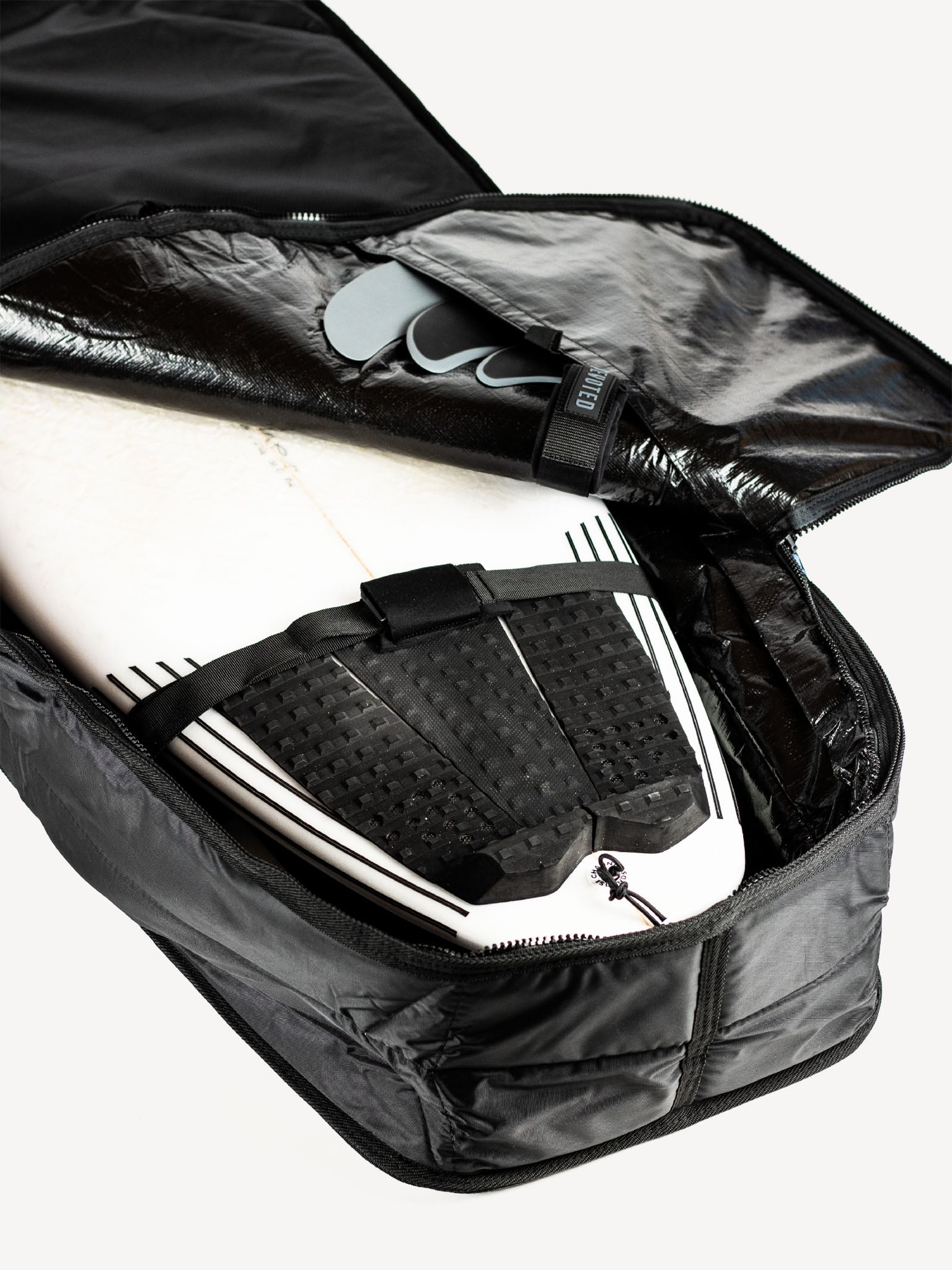 “Ventilation and shoulder strap system shown in close-up of Fish boardbag”