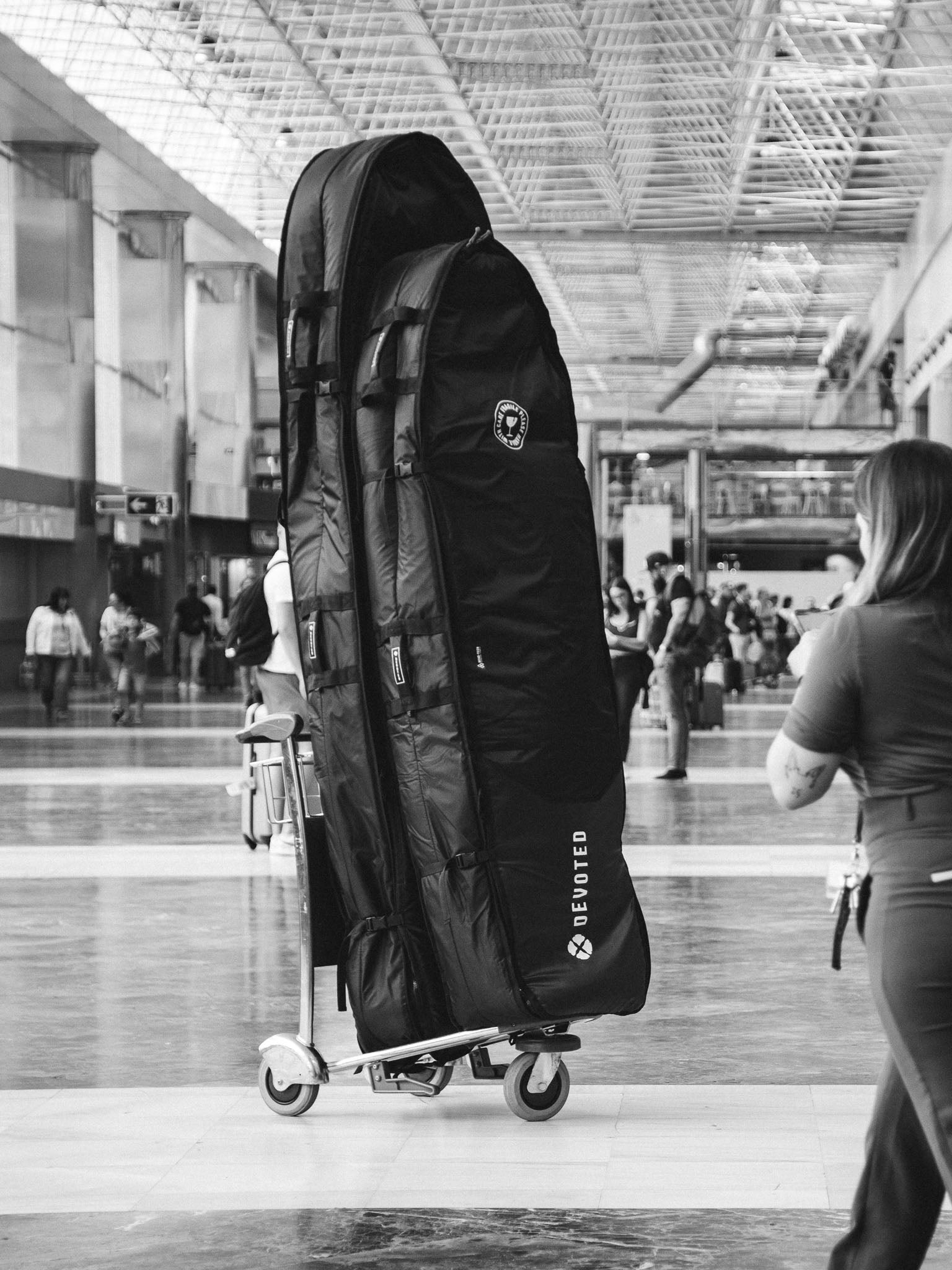 “Outdoor use shot of Fish boardbag packed with boards, placed on ground”
