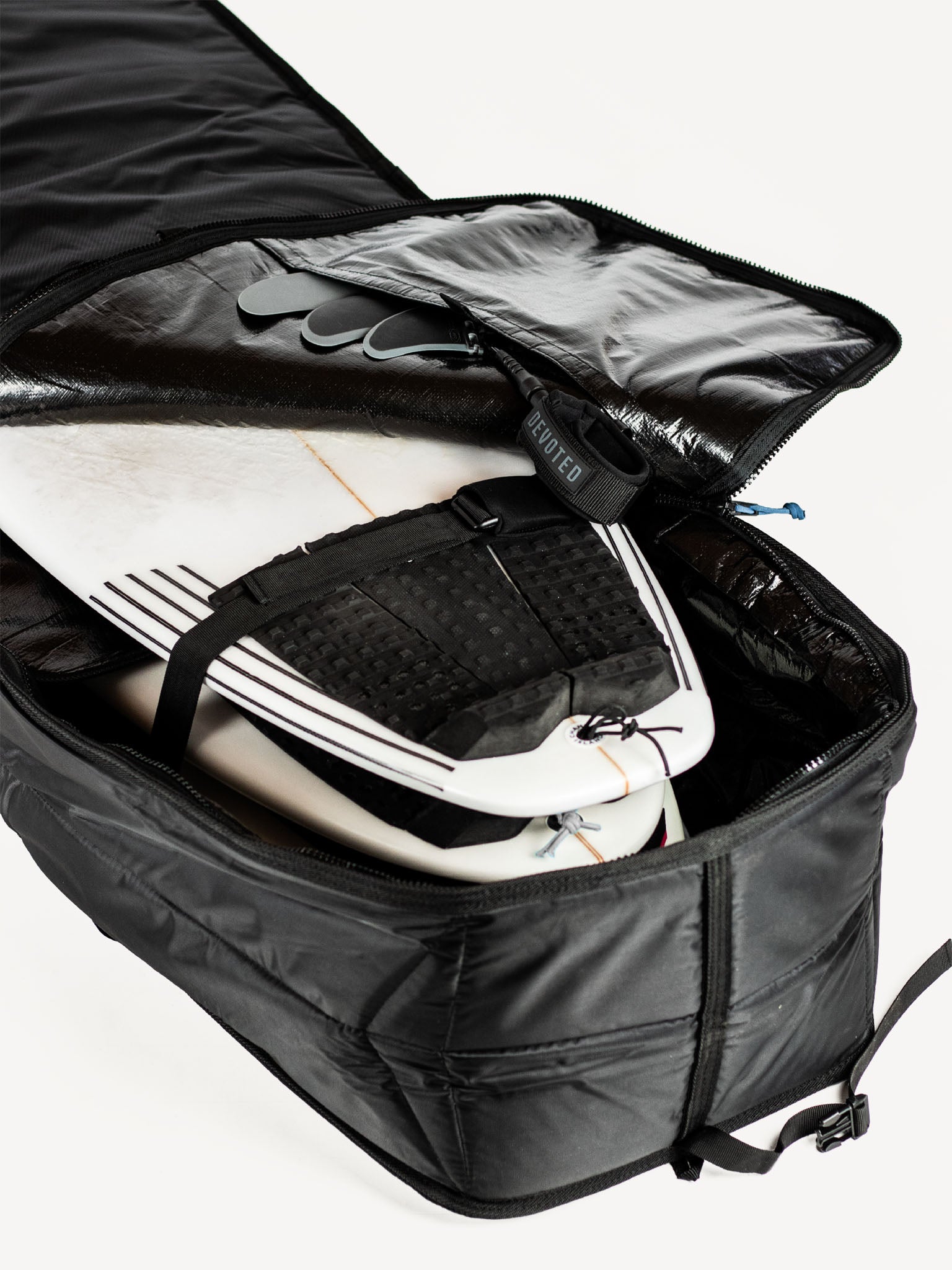 “Interior view of Fish boardbag showing quad board space and reinforced lining”
