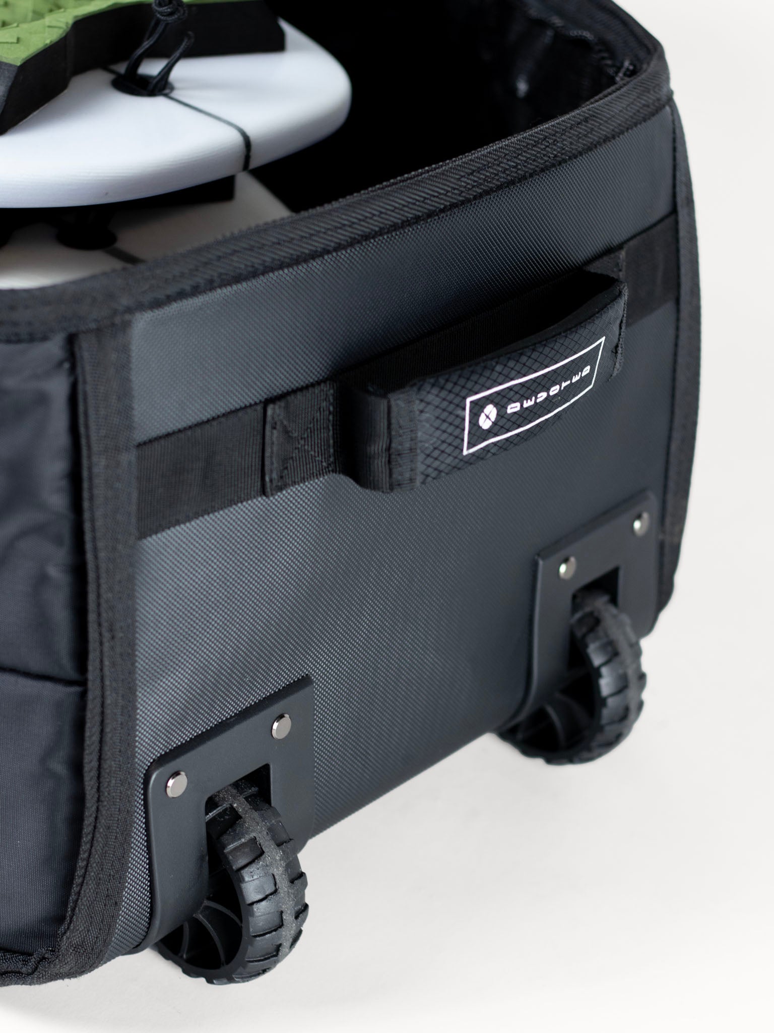 Side view of Fish 10mm Quad Wheely Travel Boardbag, highlighting thick protection and zip layout”