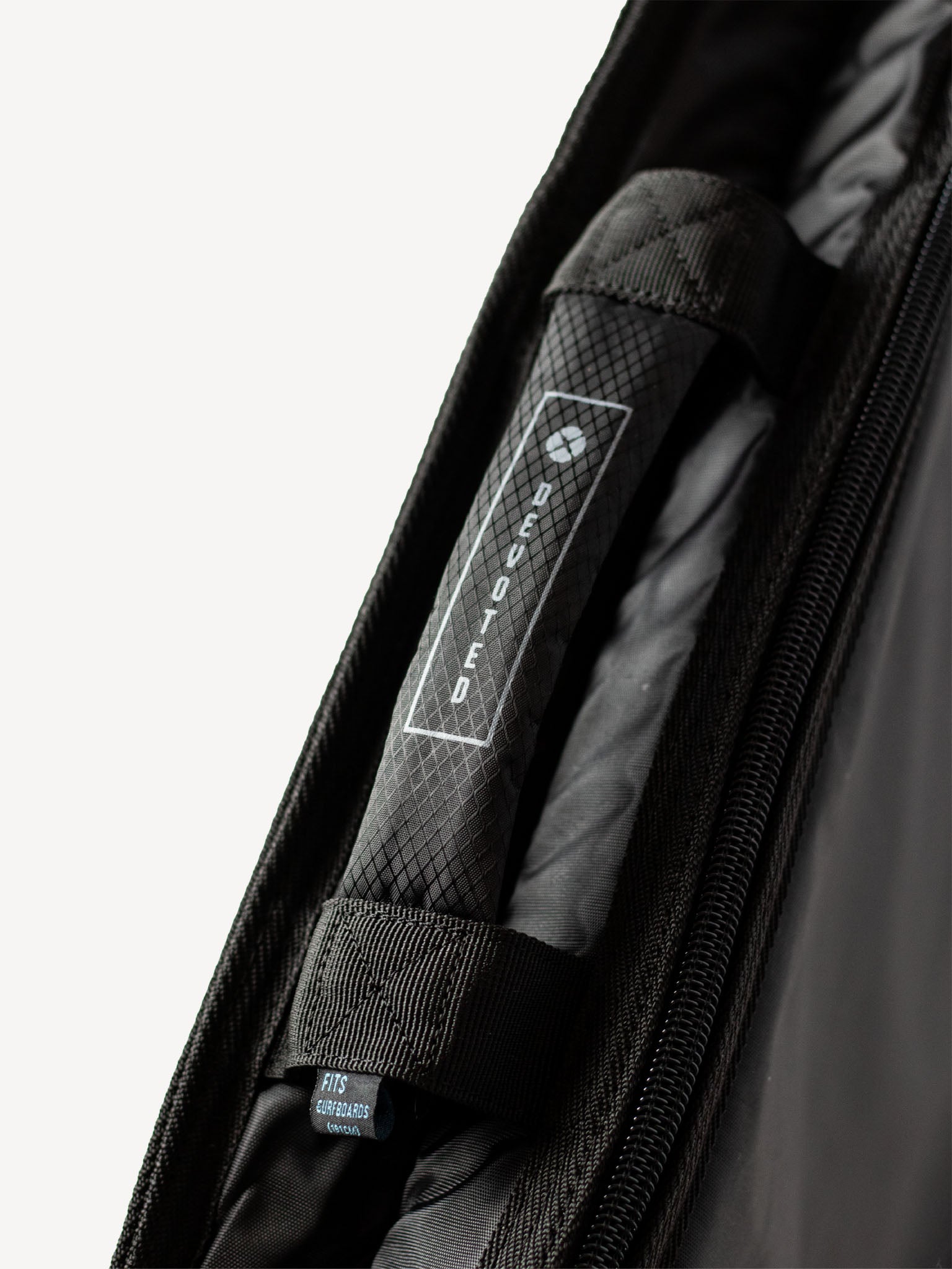 “Interior of Fish Day Bag with 8mm padding and smooth lining for board protection”
