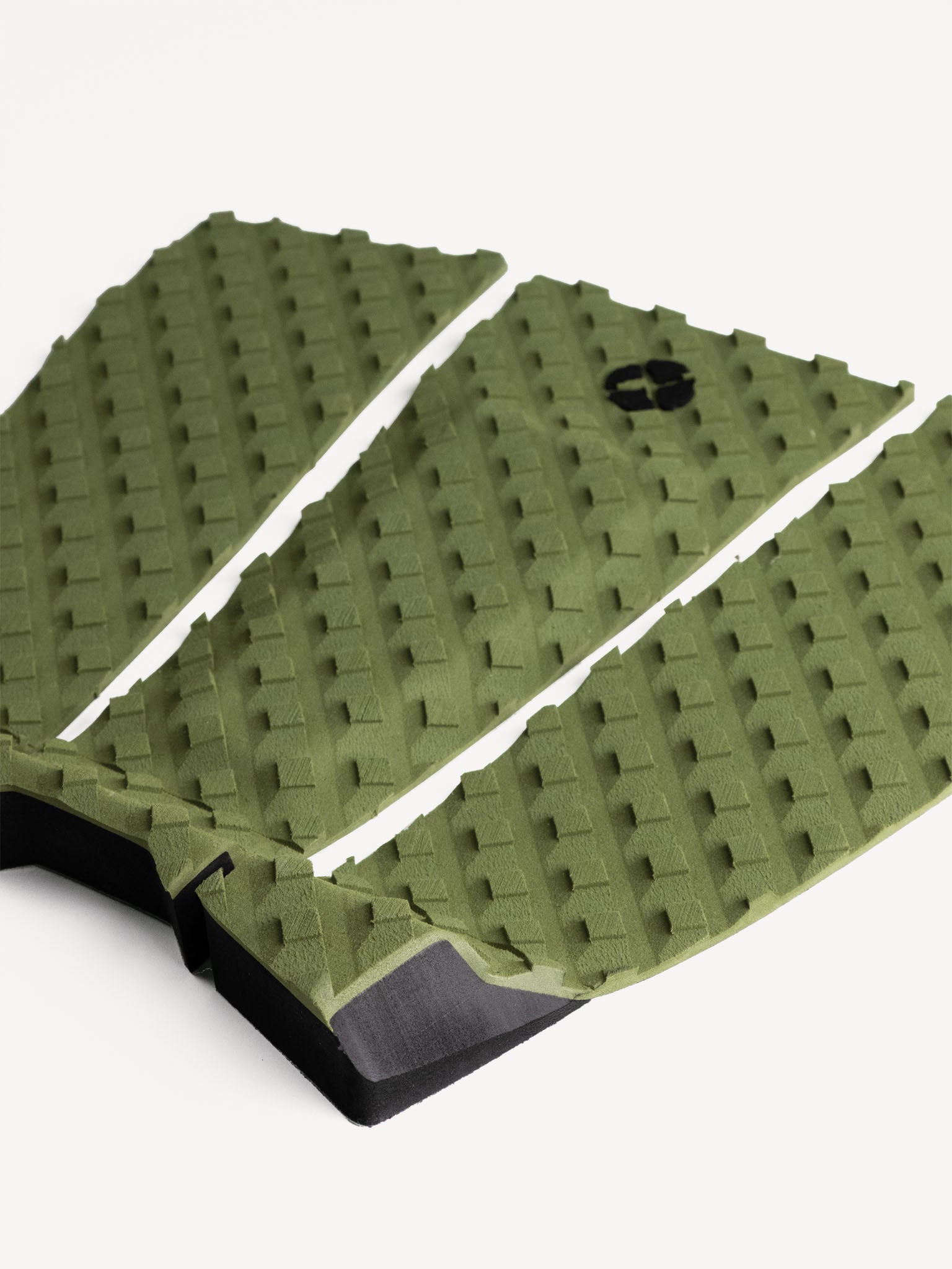 “Side angle of olive 3-piece traction pad showing texture and arch”
