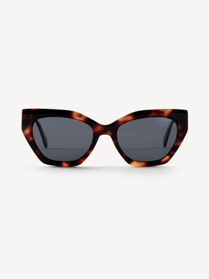 “Front view of Devoted Sanny polarized sunglasses in brown leopard with sleek rounded frame”